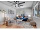Stylish living room with hardwood floors, comfortable seating, and a ceiling fan at 4520 S Delaware St, Englewood, CO 80110