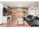 Cozy living room with fireplace, soft textures, and updated wall coverings at 4520 S Delaware St, Englewood, CO 80110