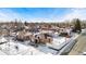 Aerial view of neighborhood with brick houses and snowy yards at 501 S Dale Ct, Denver, CO 80219