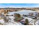 Aerial view of Huston Lake Park, tennis courts, and Denver skyline at 501 S Dale Ct, Denver, CO 80219