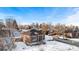 Brick ranch home with snow-covered yard, aerial view at 501 S Dale Ct, Denver, CO 80219