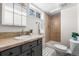 Clean basement bathroom with shower, toilet and updated vanity at 501 S Dale Ct, Denver, CO 80219