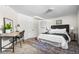 Spacious basement bedroom with a desk and ample room for sleeping at 501 S Dale Ct, Denver, CO 80219