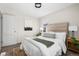 Charming bedroom featuring neutral tones, a comfortable bed, and plenty of natural light at 501 S Dale Ct, Denver, CO 80219