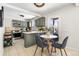 Modern kitchen with sage green cabinets and a breakfast nook at 501 S Dale Ct, Denver, CO 80219