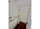 White bathroom with a shower-tub combo, white vanity, and dark floors, offering a modern design at 4036 S Himalaya Cir, Aurora, CO 80013