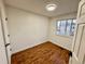 Clean bedroom with wood floors, ample natural light from a window, and a minimalist design at 4036 S Himalaya Cir, Aurora, CO 80013