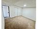 Bedroom featuring neutral carpeting, natural light, and a double-door closet at 4036 S Himalaya Cir, Aurora, CO 80013