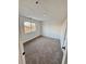 Spacious bedroom with carpet, a large window for natural light, and a minimalist design at 4036 S Himalaya Cir, Aurora, CO 80013