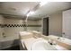 Bathroom features shower-tub combination, double sinks, and tile flooring at 2162 Concord Ln, Superior, CO 80027
