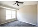 Bright bedroom features a ceiling fan and a large window for ample natural light at 2162 Concord Ln, Superior, CO 80027