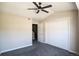 Bedroom with gray carpet features a ceiling fan and closet with bi-fold doors at 2162 Concord Ln, Superior, CO 80027