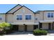 A lovely townhome featuring an attached garage, well-maintained greenery, and large windows at 2162 Concord Ln, Superior, CO 80027