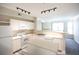 Bright kitchen includes modern appliances, light countertops, island, and stylish lighting at 2162 Concord Ln, Superior, CO 80027