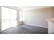 Bright living room boasts large sliding doors, neutral walls, and soft carpeting at 2162 Concord Ln, Superior, CO 80027