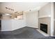 Cozy living room features neutral walls, carpeting, fireplace, and an open kitchen at 2162 Concord Ln, Superior, CO 80027