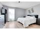 Light-filled bedroom boasts modern decor and a comfortable bed for a relaxing retreat at 14242 E Hawaii Cir # C, Aurora, CO 80012