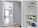 Hallway view into bedroom and pantry with shelving and storage solutions, enhancing organization at 14242 E Hawaii Cir # C, Aurora, CO 80012