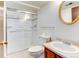 Bathroom featuring a glass-door shower, toilet, and vanity with an oval mirror at 6650 E Arizona Ave # 138, Denver, CO 80224