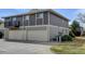 Spacious two-story townhome featuring attached garages and neutral exterior at 6650 E Arizona Ave # 138, Denver, CO 80224