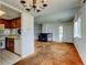 Open concept living room with kitchen, fireplace, and entryway at 6650 E Arizona Ave # 138, Denver, CO 80224
