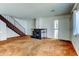 Cozy living room featuring a corner fireplace and a staircase at 6650 E Arizona Ave # 138, Denver, CO 80224