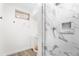 Modern bathroom featuring a stylish marble shower and updated fixtures at 920 Emerson Cir, Northglenn, CO 80233
