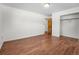 Simple bedroom with hardwood floors, a closet, and ample natural light at 920 Emerson Cir, Northglenn, CO 80233