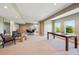Spacious finished basement with a ping pong table, a dining area, a bar and seating area at 9728 Ashleigh Ln, Highlands Ranch, CO 80126