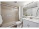 Bathroom featuring a glass shower, white vanity, and updated fixtures at 9728 Ashleigh Ln, Highlands Ranch, CO 80126