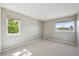 Neutral bedroom with a large window, offering pleasant views and ample natural light at 9728 Ashleigh Ln, Highlands Ranch, CO 80126