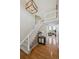 Inviting foyer featuring hardwood floors, a staircase, and an open view to the living room beyond at 9728 Ashleigh Ln, Highlands Ranch, CO 80126