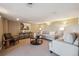 Living room featuring neutral tones, a comfortable couch, and modern decor at 9728 Ashleigh Ln, Highlands Ranch, CO 80126