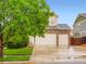 Beautiful two-story home with a two-car garage and stone accents under a clear sky at 10570 Worchester Dr, Commerce City, CO 80022