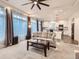 Comfortable open-concept living room flowing into a modern kitchen with stainless steel appliances at 10570 Worchester Dr, Commerce City, CO 80022
