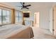 Main bedroom featuring neutral carpet, recessed lighting, a ceiling fan, and large windows at 10570 Worchester Dr, Commerce City, CO 80022