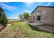 Backyard view featuring the home's rear exterior, patio and storage shed at 7998 Faith Ct, Frederick, CO 80530