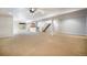 Finished basement featuring carpet, a bar, and stairs to the upper level at 7998 Faith Ct, Frederick, CO 80530