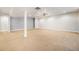 Spacious finished basement featuring neutral carpet, light walls, and ceiling fan, ideal for flexible living at 7998 Faith Ct, Frederick, CO 80530