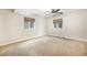 Neutral bedroom with carpet, fan, and windows providing natural light at 7998 Faith Ct, Frederick, CO 80530