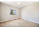 Bedroom featuring carpet, neutral paint, and a view of the surrounding landscape at 7998 Faith Ct, Frederick, CO 80530