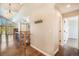 Hallway with hardwood flooring, coat hooks, and access to rooms, blending style and functionality at 7998 Faith Ct, Frederick, CO 80530