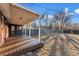 Covered deck and spacious backyard with mature trees at 3307 Teller St, Wheat Ridge, CO 80033