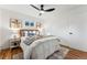 Bright bedroom featuring hardwood floors and ceiling fan at 3307 Teller St, Wheat Ridge, CO 80033