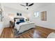 Comfortable bedroom with hardwood floors and ceiling fan at 3307 Teller St, Wheat Ridge, CO 80033