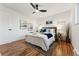 Well-lit bedroom with hardwood floors and ceiling fan at 3307 Teller St, Wheat Ridge, CO 80033