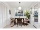 Bright dining area with mid-century modern table and chairs at 3307 Teller St, Wheat Ridge, CO 80033