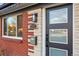 Modern front door with glass panels and updated hardware at 3307 Teller St, Wheat Ridge, CO 80033