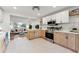 Modern kitchen features stainless steel appliances and light wood cabinets at 3307 Teller St, Wheat Ridge, CO 80033