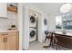 Convenient laundry room with stacked washer and dryer at 3307 Teller St, Wheat Ridge, CO 80033